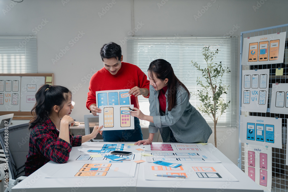 Aufkleber group of young asian ux ui designers working and planning and developing mobile app design wireframe