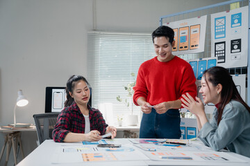 Diverse group of young professionals engaging in a collaborative meeting, brainstorming ideas for...
