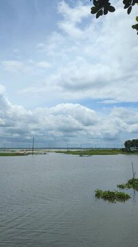 Traditional Boat Navigating Waterway Under Cloudy Sky | Rural Bangladesh Monsoon Travel