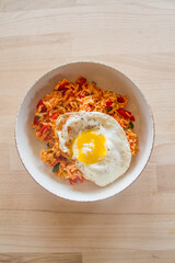 Tomato rice with fried egg, vegetarian dish, ready to eat (top view from directly above)