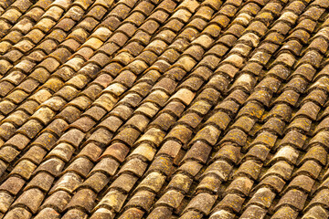 orange and brown old tile roof texture background. Old vintage roof tiles backdrop for concept and design.