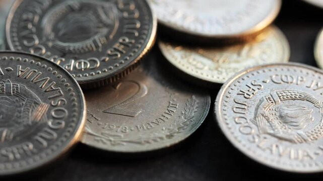 Obsolete Yugoslav dinar and para coins with clear socialist emblem, macro rotating shot