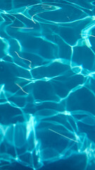 Rippling azure waves dance in sunlit patterns, reminiscent of midsummer dreams, inviting tranquility and introspection during World Oceans Day