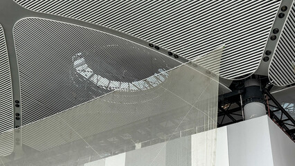 Intricate mesh ceiling waltzes with light, celebrating Architectural Digest Day and the whimsical...