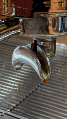 Gleaming espresso spout conjures caffeinated dreams, evoking National Coffee Day vibes and the...