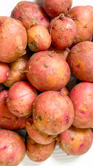 Earth-kissed red potatoes whispering rustic tales of autumns hearth, perfect for Samhain feasts and Carnival stews
