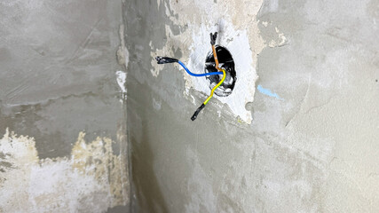 Exposed tangled wires peek from cracked cement, evoking ghostly echoes of Festivus celebrations and...