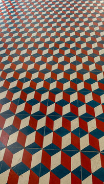 Mesmerizing geometric tile pattern echoes ancient labyrinthine mazes, invoking the festival of Diwali's vibrant decorations and Escher-esque illusions