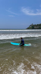 Surfboard serenade, lone surfer balancing azure dreams, Pacific symphony vibes, International...