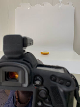 Food photography of burger. Lens poised like a vigilant eye, capturing a solitary coin, evoking Plutus' silent wealth, perfect for World Thrift Day