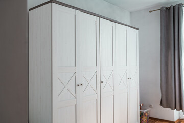 Classic wardrobe furniture in a bedroom.