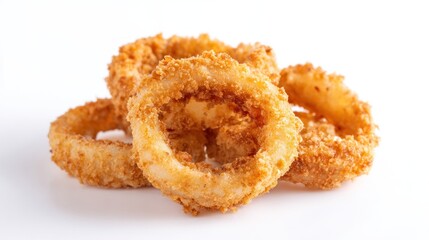 Golden crispy onion rings stacked on a white surface for fast food menu