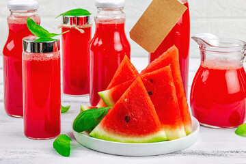 Homemade watermelon kombucha. Healthy probiotic drink, kvass with basil leaves. Fermented beverage