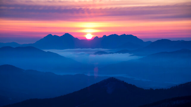 A dramatic sunrise over jagged mountain peaks, golden light piercing misty valleys, casting long shadows across rugged cliffs and snow-dusted ridges