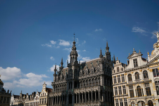 Ornate historical building with detailed architecture under a clear blue sky. Brussels, Belgium