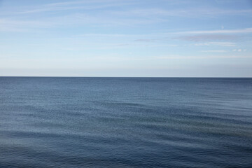 Calm blue ocean stretching to the horizon under a clear sky.