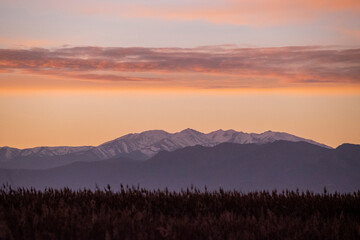 The Pyrenees mountains with snow-capped peaks at sunset