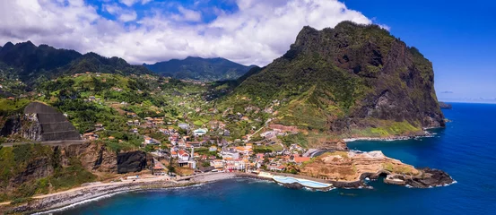 Gardinen amazing Madeira island nature scenery. aerial panorama of beautiful rocky coast and Porto da Cruz village with natural pools in northern part. Portugal © Freesurf