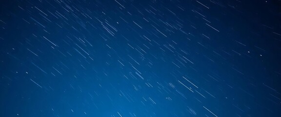 Abstract bright white star streaks across a deep blue night sky, cosmic dust trails visible, background, illustration