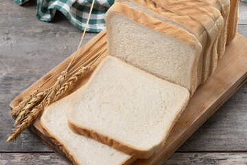 Sliced of White Bread on wooden table.