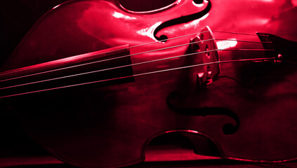 Double Bass Lies On The Stage Floor At Concert In Red Light