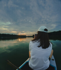 Paddleboarding at Sunset on a Calm Lake