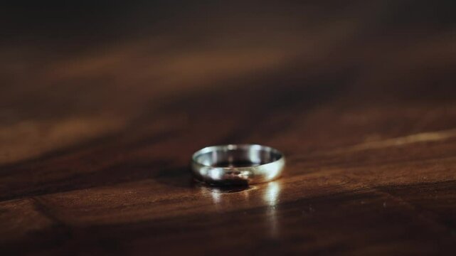 A feeling of love that fades. The woman removes wedding ring from finger. Adultery and divorce concept. High quality 4k footage