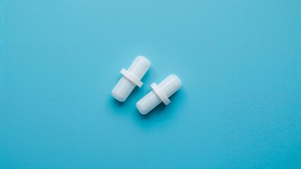 Protective ear plugs displayed on vibrant blue background
