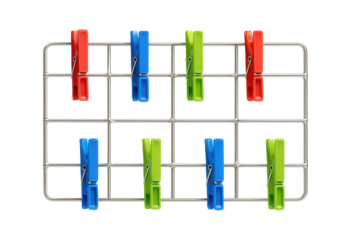 A metal wire grid with colorful clothespins, ideal for hanging postcards and notes in a kitchen.