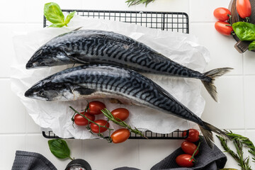 fresh mackerel fish carcass on a bright table. preparation for cooking dinner. fish in the oven on the grill. raw, unpeeled fish