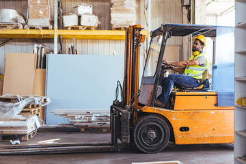 Warehouse Worker Operating Forklift in Industrial Storage Facility