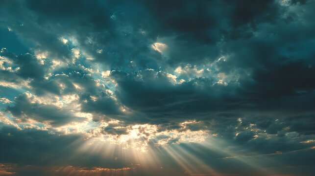 Dramatic sky bursting with sunlight hope and the promise of a brighter tomorrow against turbulent clouds captured with
