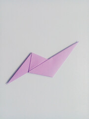 Purple lightning origami isolated on white background.