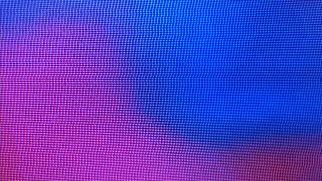 Static close-up of digital screen pixels showing magenta to blue gradient. Abstract, vibrant, and perfect for tech or digital art backgrounds.