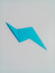 Blue lightning origami isolated on white background.