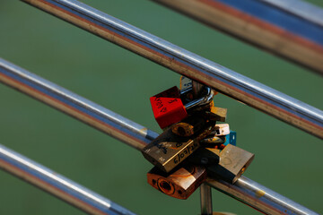 Love padlocks on steel railings overlooking water