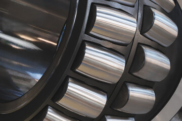 Ball bearing with a black outer shell and silver inner shell.  inner shell is made of metal