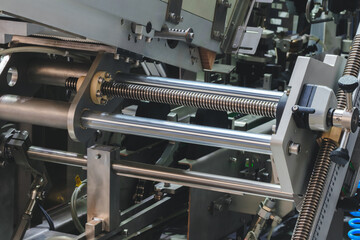 Conveyor line for the production of boxes. Machine cuts cardboard boxes from sheets of cardboard. Enterprise for  production package