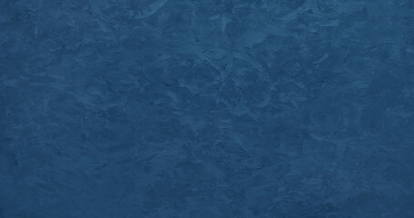 wall is a deep blue color and has a textured surface. The texture gives the wall a unique and interesting appearance