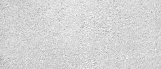 Fototapeta premium White wall with a white background. The wall is made of concrete. There are no other colors visible.