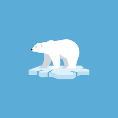 Fototapeta premium Polar bear standing on ice against blue background 