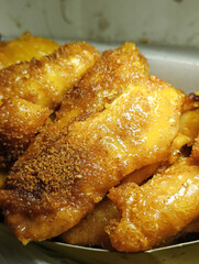 Close up of fried banana with brown sugar topping