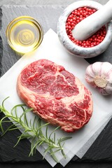 Piece of raw beef meat and spices on table, flat lay