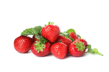 Pile of fresh strawberries and green leaves isolated on white