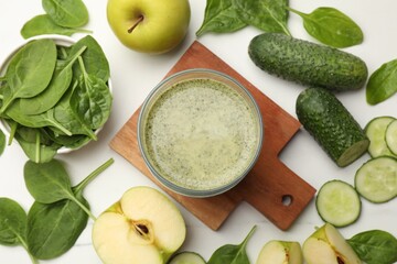 Tasty smoothie and spinach leaves on white marble table, flat lay