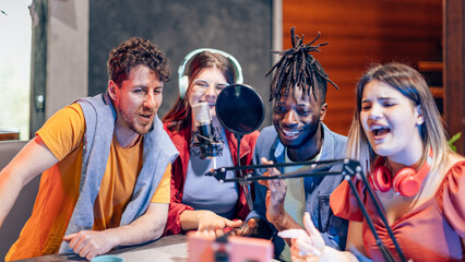 Four happy content creators recording a podcast in a studio