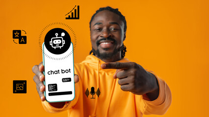 Man showcasing chatbot app on smartphone while standing against vibrant orange background