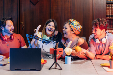 Content creators having fun recording podcast or streaming online