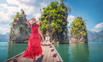 Panorama of the nature of famous places in Thailand - A woman in a Red dress looks at the landscape...