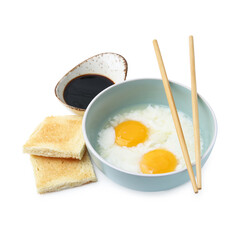 Half-boiled eggs in bowl, soy sauce, toasts and chopsticks isolated on white. Traditional asian breakfast